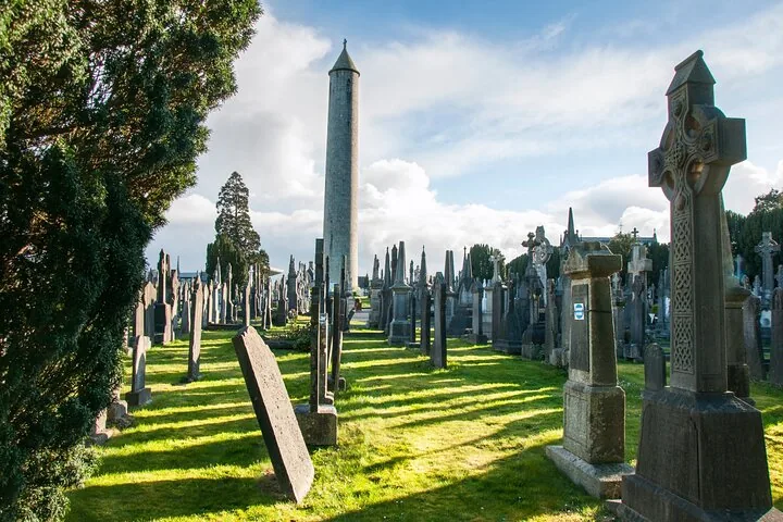 Round tower and various headstones at Glasnevin Cemetery in Dublin